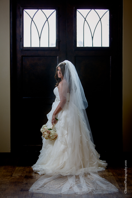 C. Baron Photography, Houston Wedding Photographer, Briscoe Manor, Richmond Texas, longhorn cattle, chapel, Paloma Blanca, cathedral veil, ruffled ballgown, cowboy boots