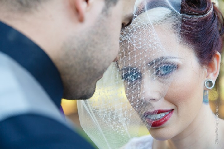 C. Baron Photography, Houston Wedding Photographer, Crystal Springs, Magnolia Texas, Magnolia Wedding Photographer, outdoor wedding, purple, red, Oleg Cassini, illusion neckline, tea length, tatoo, brooch bouquet, birdcage veil, rockabilly, edgy, sunset