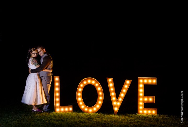 C. Baron Photography, Houston Wedding Photographer, Crystal Springs, Magnolia Texas, Magnolia Wedding Photographer, outdoor wedding, purple, red, Oleg Cassini, illusion neckline, tea length, tatoo, brooch bouquet, birdcage veil, rockabilly, edgy, sunset