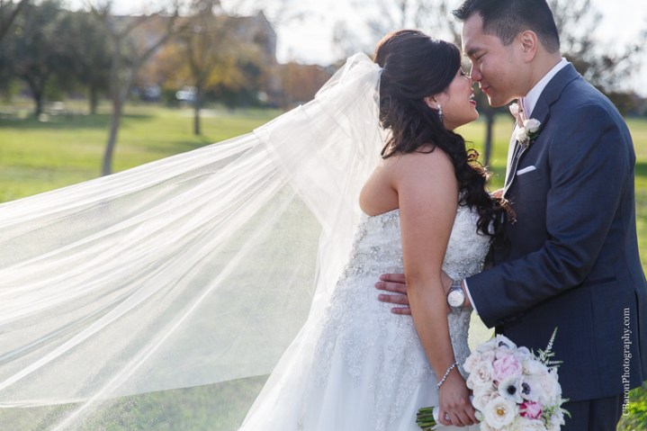 C. Baron Photography, Houston Wedding Photographer, Notre Dame Catholic Church, blush, bride, groom, couple, confetti cannons, confetti poppers, gold, stained glass, cathedral veil, Vietnamese, chandelier, sparklers, South Asian