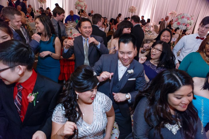 C. Baron Photography, Houston Wedding Photographer, Notre Dame Catholic Church, blush, bride, groom, couple, confetti cannons, confetti poppers, gold, stained glass, cathedral veil, Vietnamese, chandelier, sparklers, South Asian