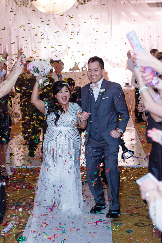 C. Baron Photography, Houston Wedding Photographer, Notre Dame Catholic Church, blush, bride, groom, couple, confetti cannons, confetti poppers, gold, stained glass, cathedral veil, Vietnamese, chandelier, sparklers, South Asian