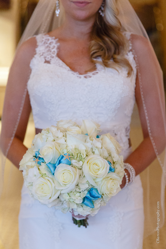C. Baron Photography, Galveston Wedding Photographer, Hotel Galvez and Spa, blue, Christmas, December, Downtown Blooms, groom, bride, couple, seawall, waves, starfish, veil, umbrella, Pleasure Pier, rain, candy bar, beach