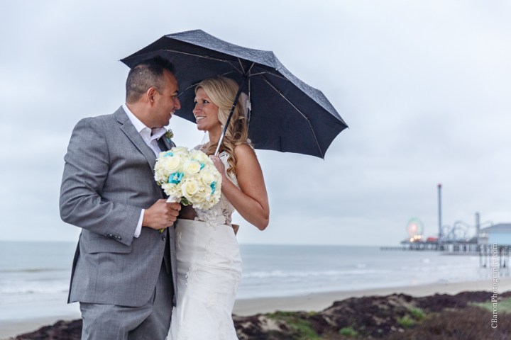 C. Baron Photography, Galveston Wedding Photographer, Hotel Galvez and Spa, blue, Christmas, December, Downtown Blooms, groom, bride, couple, seawall, waves, starfish, veil, umbrella, Pleasure Pier, rain, candy bar, beach