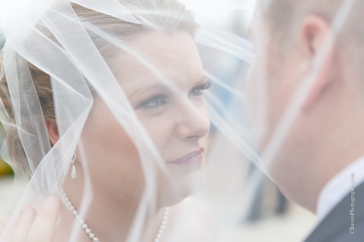 C. Baron Photography; Casablanca lilies; Cinderella cake; Couple; Galveston Wedding Photographer; Hotel Galvez; Houston Wedding Photographer; Music Hall; Spring; Strapless; Texas; blue; blue galaxy orchid; bride; confetti; dendrobium; first look; galveston; groom; lace; purple; rain; reception; sand; seawall; ceremony; singapore orchid; teal; 