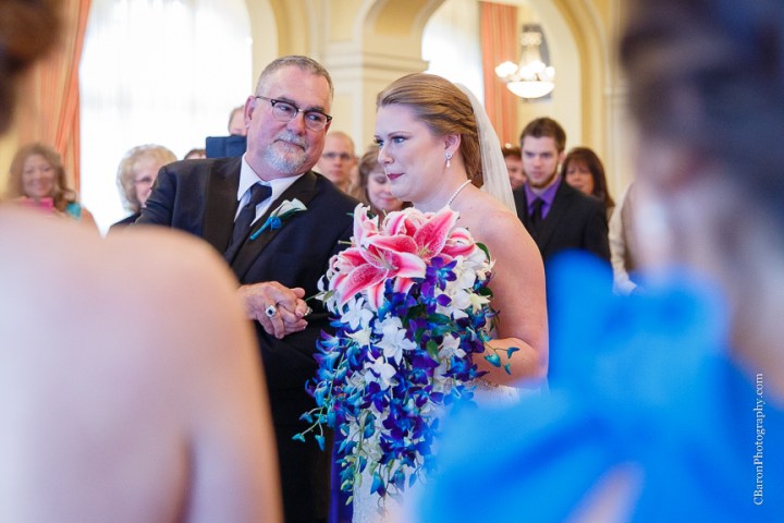 C. Baron Photography; Casablanca lilies; Cinderella cake; Couple; Galveston Wedding Photographer; Hotel Galvez; Houston Wedding Photographer; Music Hall; Spring; Strapless; Texas; blue; blue galaxy orchid; bride; confetti; dendrobium; first look; galveston; groom; lace; purple; rain; reception; sand; seawall; ceremony; singapore orchid; teal; 