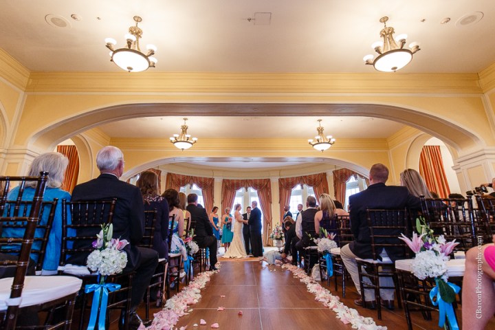 C. Baron Photography; Casablanca lilies; Cinderella cake; Couple; Galveston Wedding Photographer; Hotel Galvez; Houston Wedding Photographer; Music Hall; Spring; Strapless; Texas; blue; blue galaxy orchid; bride; confetti; dendrobium; first look; galveston; groom; lace; purple; rain; reception; sand; seawall; ceremony; singapore orchid; teal; 