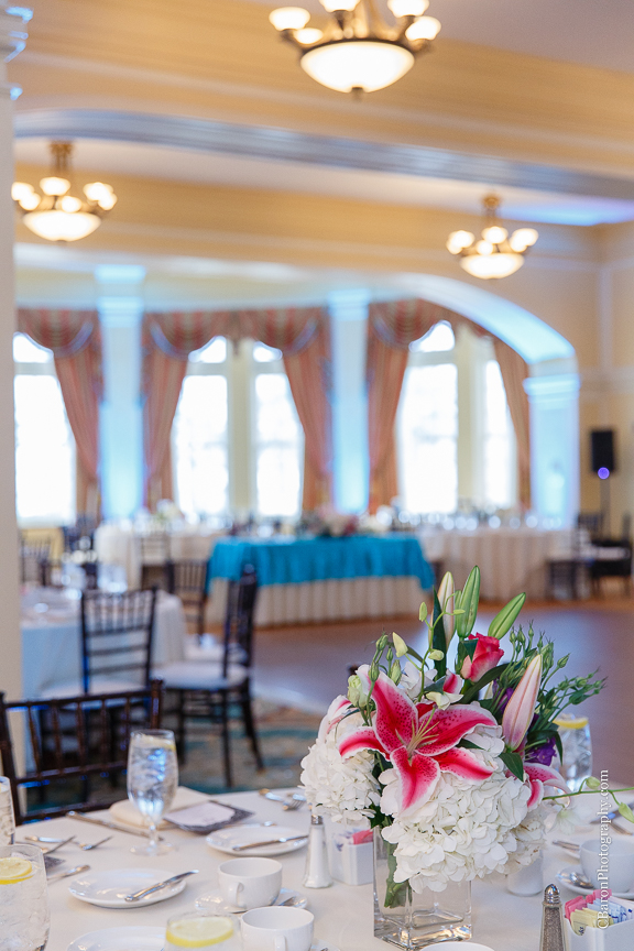 C. Baron Photography; Casablanca lilies; Cinderella cake; Couple; Galveston Wedding Photographer; Hotel Galvez; Houston Wedding Photographer; Music Hall; Spring; Strapless; Texas; blue; blue galaxy orchid; bride; confetti; dendrobium; first look; galveston; groom; lace; purple; rain; reception; sand; seawall; ceremony; singapore orchid; teal; 