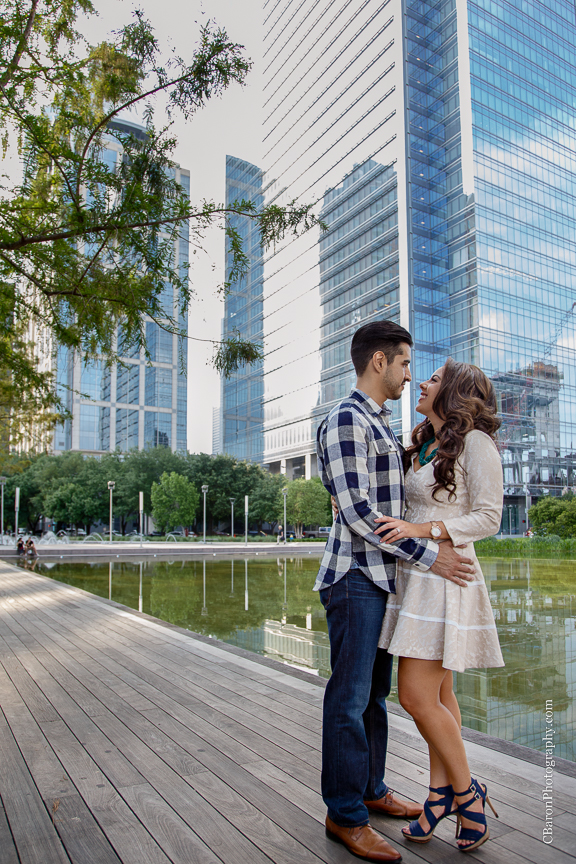 Buildings; C. Baron Photography; Couple; Discovery Green; Downtown; Dress; Engagement; Houston Engagement Photographer; Houston Wedding PHotographer; Nature; Park; Spring; Springtime; Texas; 