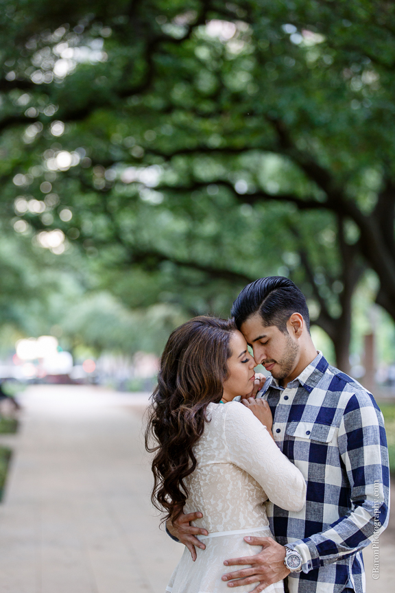Buildings; C. Baron Photography; Couple; Discovery Green; Downtown; Dress; Engagement; Houston Engagement Photographer; Houston Wedding PHotographer; Nature; Park; Spring; Springtime; Texas; 