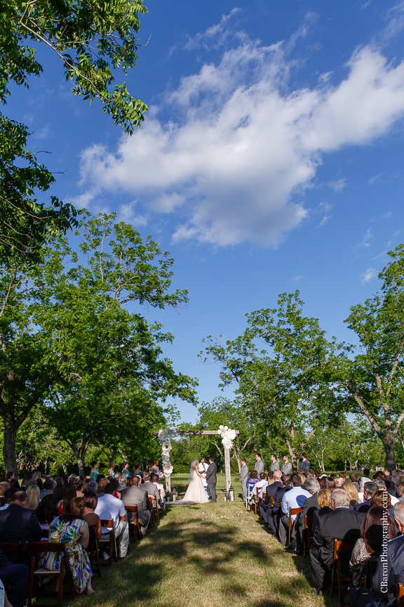 Elegant; Houston Wedding Photographer; Princess Bridal; Texas; Tomball; Tomball Wedding Photographer; Woodlands Wedding photographer; beaded; blue; blush strapless gown; books; c. Baron Photography; chandelier Grove; chandeliers; chic; farmhouse; first look; grand march; lace runner; literary; magenta; mint; mismatched china; old barn; outdoor ceremony; rolls royce; roses; sparklers; tulle ballgown; wedding band; 