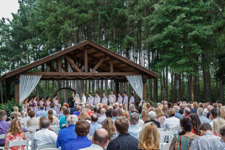 Bride; Couple; Cystal Springs; Groom; Houston Wedding Photographer; Magnolia; Purple; Springs Events; Texas; Wedding; Woodlands Wedding PHotographer; candles; crystal chandeliers; elegant; lavendar; lilac; outdoor ceremony; 