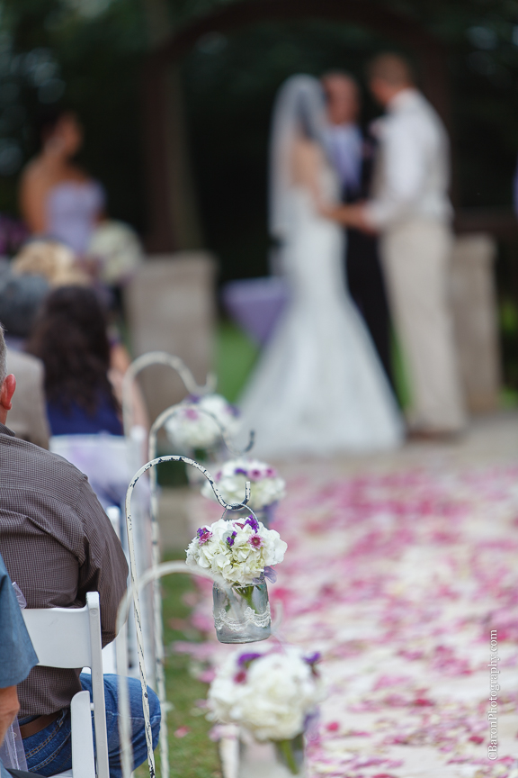 Bride; Couple; Cystal Springs; Groom; Houston Wedding Photographer; Magnolia; Purple; Springs Events; Texas; Wedding; Woodlands Wedding PHotographer; candles; crystal chandeliers; elegant; lavendar; lilac; outdoor ceremony;