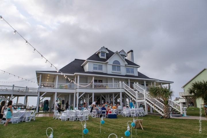 Aqua; Beach House; Beach Photographer; Beach Wedding; Blue; Bolivar Peninsula; C. Baron Photography; Crystal Beach; Crystal Beach Weddings; Galveston County; Galveston Wedding Photographer; Houston Wedding Photographer; Paper flowers; Tropical theme; Turquoise; barefoot; beach; brooch; coral; ferry; fireworks; gulf; lace gown; ocean; sand; sand dunes; sandals; sea; seashells; sunglasses; updo; waves; wayfarers; 