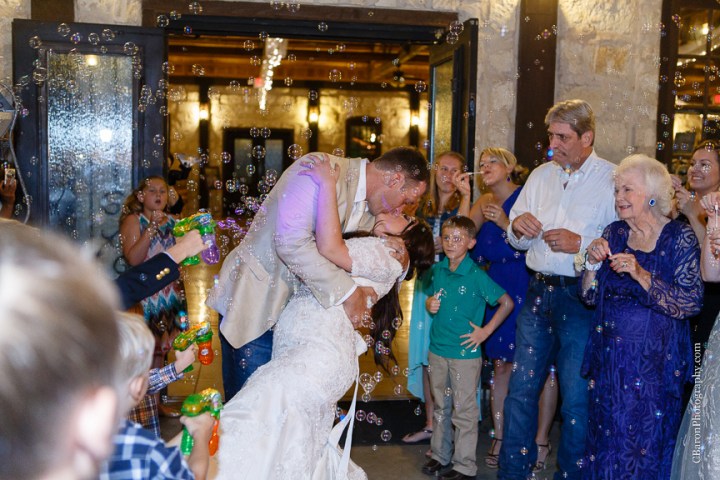 C. Baron Photography; Crystal Springs; Houston Wedding Photographer; July; Magnolia; Magnolia Wedding photographer; Shepherd hooks; Summer; Swanky Photobooth; Texas; Woodlands Wedding Photographer; baby's breath; bell jars; black; bride; brooch bouquet; bubbles; burlap; cloche jars; cowboy boots; groom; ivory; lace; lace gown; memory jars; outdoor ceremony; outdoor wedding; quicksand; rolls royce; roses; 