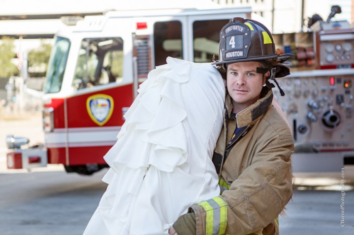 2013; Bride; C. Baron Photography; Downtown; Fire truck; HFD; Houston Wedding Photographer; Texas; fire hose; firemen; houston fire department; strapless gown; trash the dress; 