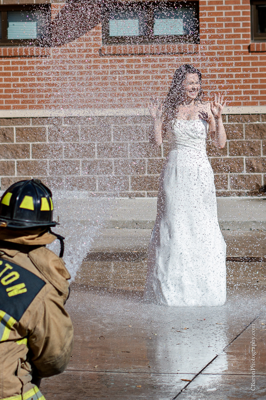 2013; Bride; C. Baron Photography; Downtown; Fire truck; HFD; Houston Wedding Photographer; Texas; fire hose; firemen; houston fire department; strapless gown; trash the dress; 