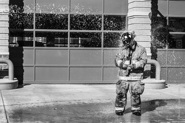 2013; Bride; C. Baron Photography; Downtown; Fire truck; HFD; Houston Wedding Photographer; Texas; fire hose; firemen; houston fire department; strapless gown; trash the dress; 