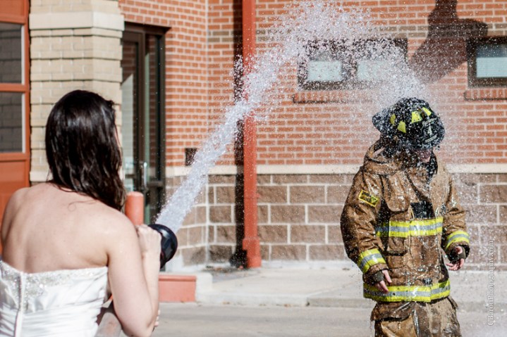 2013; Bride; C. Baron Photography; Downtown; Fire truck; HFD; Houston Wedding Photographer; Texas; fire hose; firemen; houston fire department; strapless gown; trash the dress; 