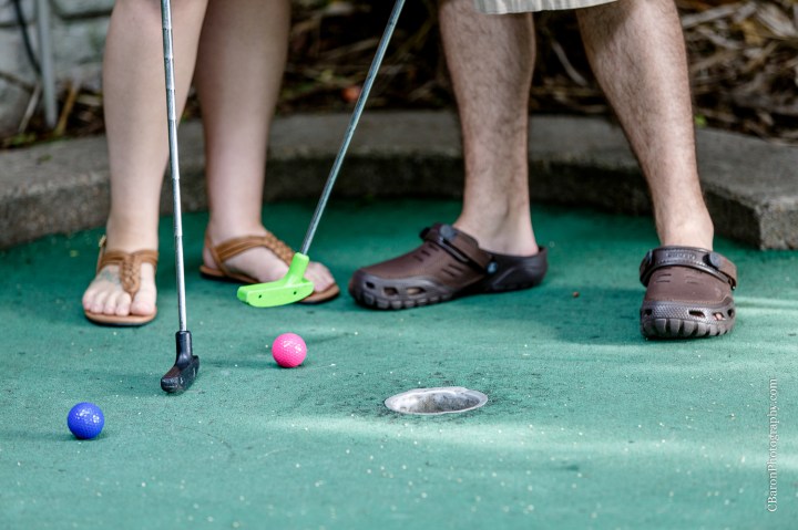 C. Baron Photography; Galveston; Galveston Engagement Photographer; Houston Wedding PHotographer; Jean Jacket; Texas; couple; engagement session; mini-golf; outdoors; putt-putt; summer; tree; 