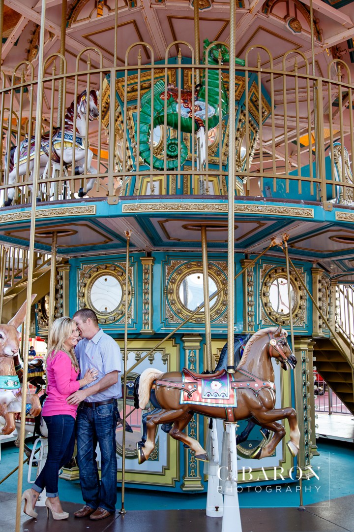 Beach; C. Baron Photography; Carnival; Couple; Engagement session; Galveston; Galveston Engagement Photographer; Galveston Island; Galveston Wedding Photographer; Houston Wedding Photographer; Pleasure Pier; Rides; Seawall; Texas; Texas Wedding Photographer; boardwalk; carousel; roller coaster;