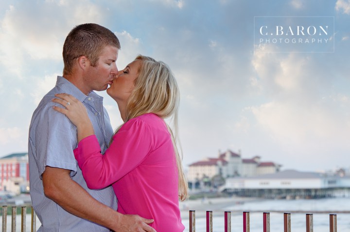 Beach; C. Baron Photography; Carnival; Couple; Engagement session; Galveston; Galveston Engagement Photographer; Galveston Island; Galveston Wedding Photographer; Houston Wedding Photographer; Pleasure Pier; Rides; Seawall; Texas; Texas Wedding Photographer; boardwalk; carousel; roller coaster;
