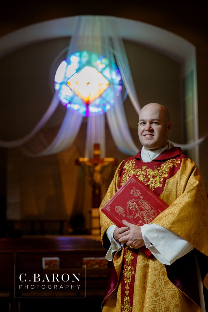 Houston; Ordination; Portrait photographer; Prince of Peace; Texas; altar; clergy; crucifix; portrait; priest; vestments;