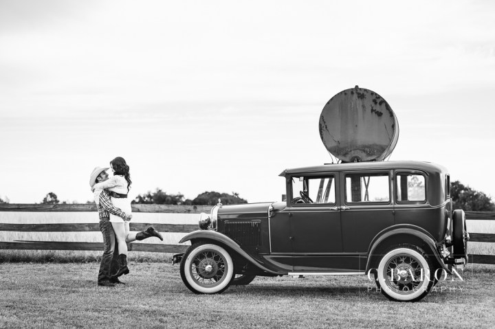 '32 Ford, Brenham Engagement Photographer, C. Baron Photography, camo, Country, Couple, cowboy hat, donkeys, Engagement session, farm, Fence, Grass, hills, Houston Engagement Photographer, John Deere Tractor, Old Oaks, sunset, Texas