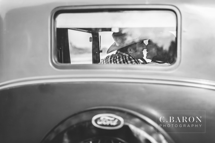 '32 Ford, Brenham Engagement Photographer, C. Baron Photography, camo, Country, Couple, cowboy hat, donkeys, Engagement session, farm, Fence, Grass, hills, Houston Engagement Photographer, John Deere Tractor, Old Oaks, sunset, Texas