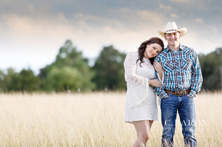 '32 Ford, Brenham Engagement Photographer, C. Baron Photography, camo, Country, Couple, cowboy hat, donkeys, Engagement session, farm, Fence, Grass, hills, Houston Engagement Photographer, John Deere Tractor, Old Oaks, sunset, Texas