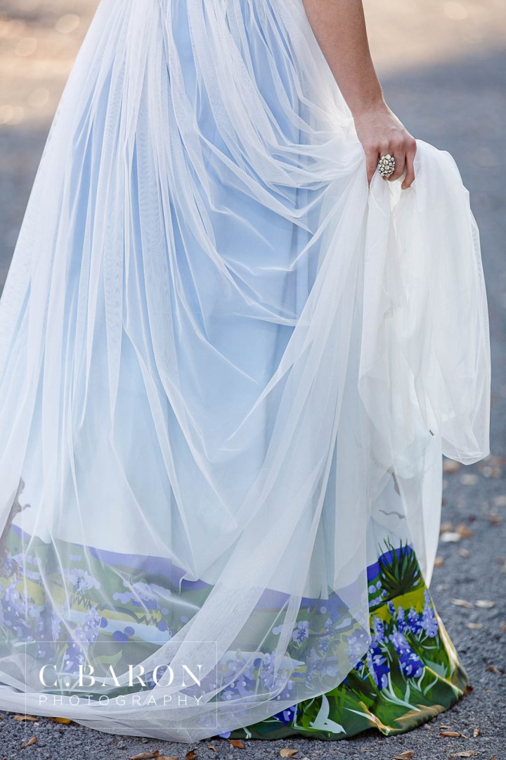Bluebonnet season is here! These pretty little Texan shades of Blue are lining fields everywhere. We had the pleasure of creating a lovely Bluebonnet inspired shoot with some of our vendor friends at The Carriage House. We had gorgeous weather and it was so nice to get into the springtime weather! Just check out the bluebonnets on the bottom of that dress. Incredible, right? Photography: C. Baron Photography | Venue: The Carriage House Gown: Damsel White Label-Wimberly | Cake: Who made the Cake? Coordinator: Polished Wedding Planning | Makeup and Hair: Lisa Pelayo Makeup and Beauty