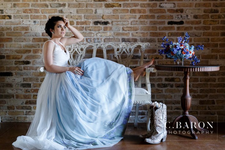 Bluebonnet season is here! These pretty little Texan shades of Blue are lining fields everywhere. We had the pleasure of creating a lovely Bluebonnet inspired shoot with some of our vendor friends at The Carriage House. We had gorgeous weather and it was so nice to get into the springtime weather! Just check out the bluebonnets on the bottom of that dress. Incredible, right? Photography: C. Baron Photography | Venue: The Carriage House Gown: Damsel White Label-Wimberly | Cake: Who made the Cake? Coordinator: Polished Wedding Planning | Makeup and Hair: Lisa Pelayo Makeup and Beauty