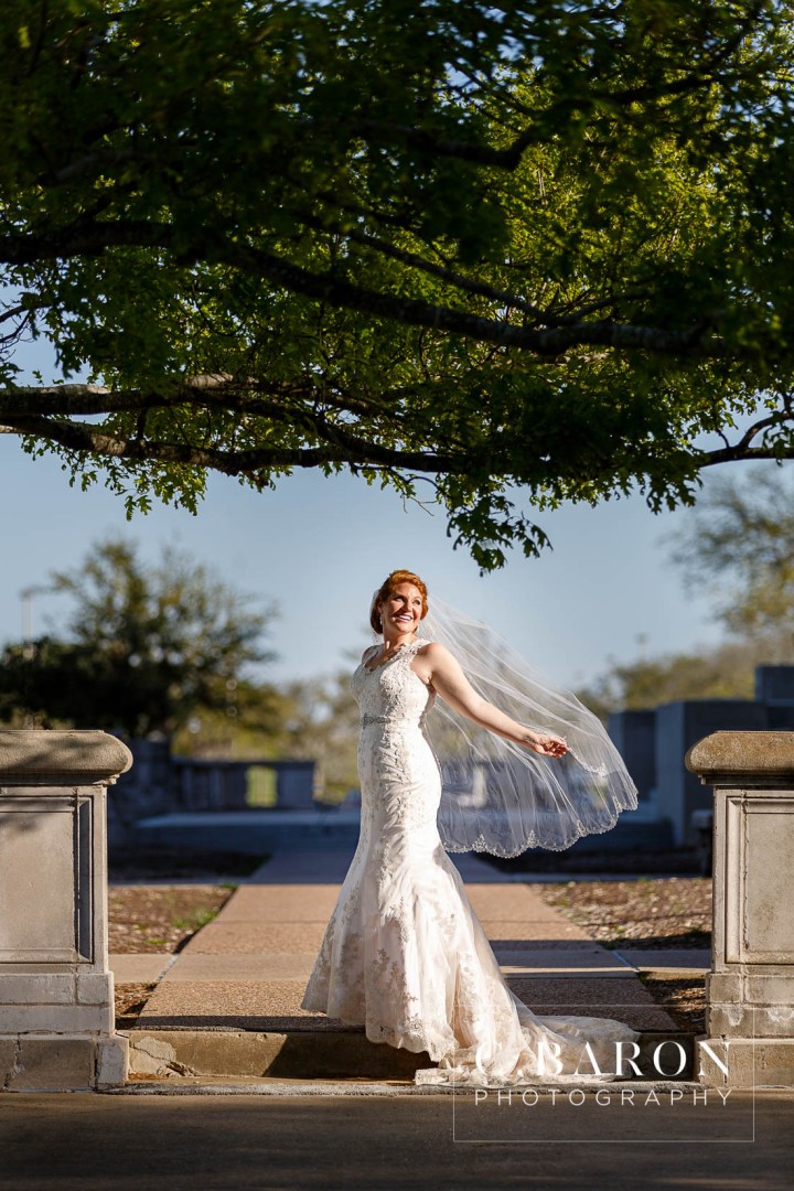 Aggies; Bluebonnets; Bridals; Campus; College Station wedding Photographer; Impression Bridal; TAMU; Texas A&M University; bottle cap Alley; on campus; red head. bridals; ruby engagement ring; sunny day; veil;