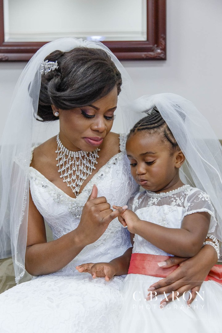 Austin Wedding Photographer; Beaumont wedding Photographer; C. Baron Photography; Catholic mass; College Station wedding Photographer; Conroe Wedding Photograher; Coral; Couple; Galveston Wedding Photographer; Groom; Houston wedding Photographer; Nigerian Wedding; Peach; Pearland; St. Helen's Catholic Church; Texas; The Bougainvilleas; Wedding; Woodlands Wedding Photographer; blush; bride; brooch bouquet; church wedding;