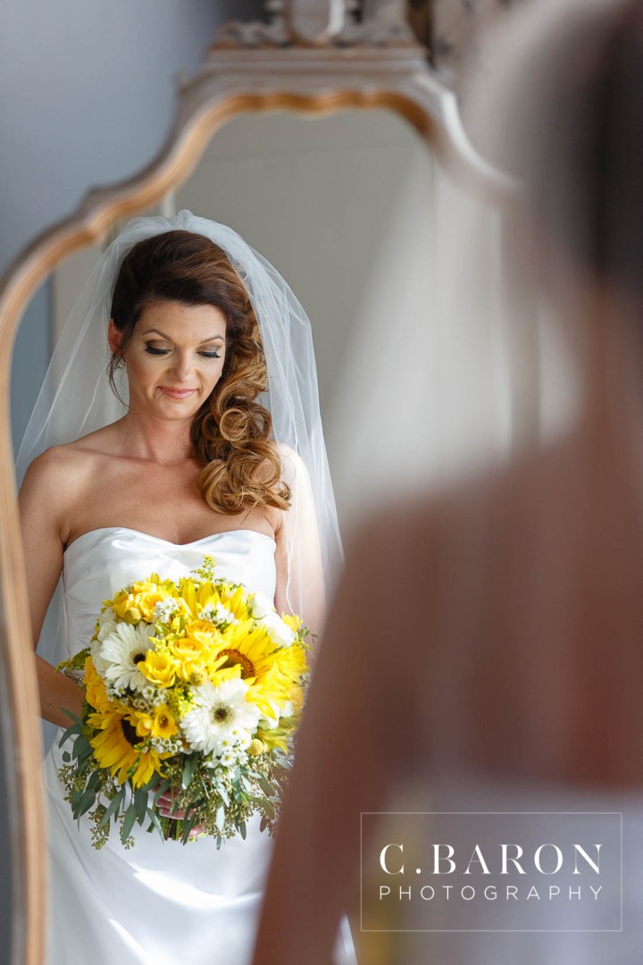 Butler's Courtyard; C. Baron Photography; Elegant; Exposed Brick; Galveston County Weddings; Historic Venue; Houston Engagement Photographer; League City; Outdoor Ceremony; Texas; Wedding Photography; Yellow; chandeliers; confetti leave; garden; sunflowers;