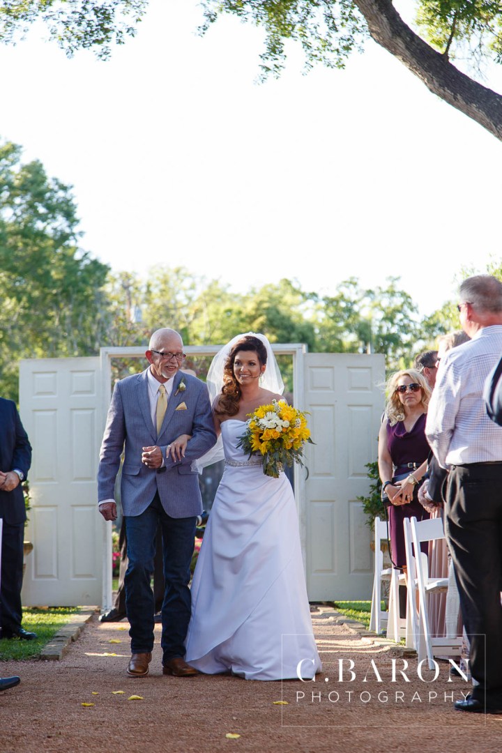 Butler's Courtyard; C. Baron Photography; Elegant; Exposed Brick; Galveston County Weddings; Historic Venue; Houston Engagement Photographer; League City; Outdoor Ceremony; Texas; Wedding Photography; Yellow; chandeliers; confetti leave; garden; sunflowers;