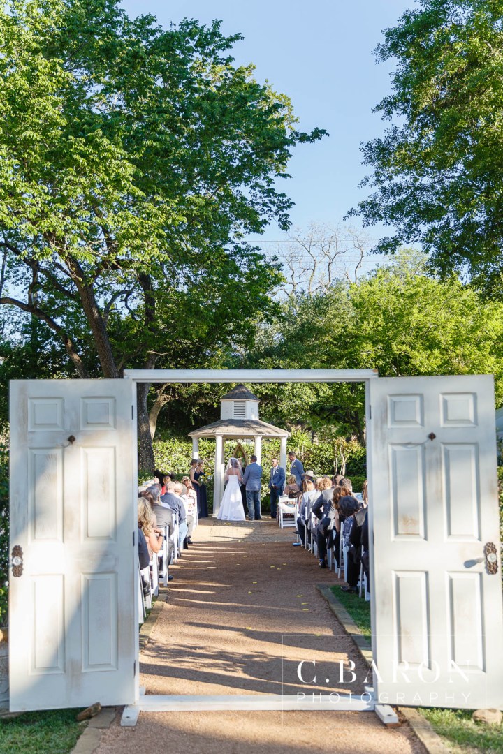 Butler's Courtyard; C. Baron Photography; Elegant; Exposed Brick; Galveston County Weddings; Historic Venue; Houston Engagement Photographer; League City; Outdoor Ceremony; Texas; Wedding Photography; Yellow; chandeliers; confetti leave; garden; sunflowers;