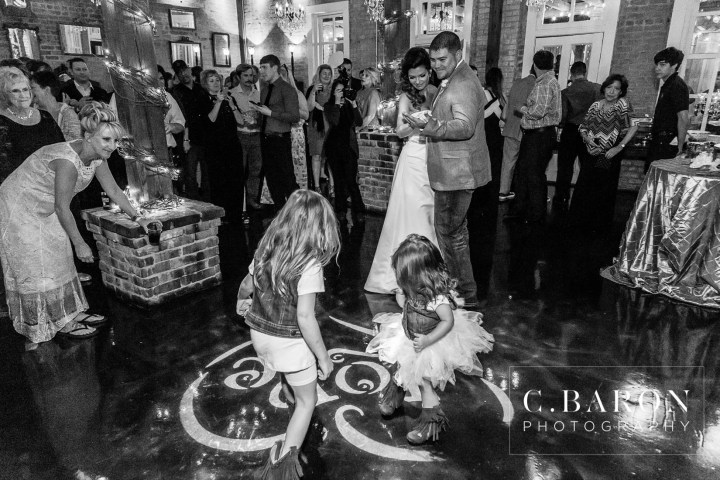 Butler's Courtyard; C. Baron Photography; Elegant; Exposed Brick; Galveston County Weddings; Historic Venue; Houston Engagement Photographer; League City; Outdoor Ceremony; Texas; Wedding Photography; Yellow; chandeliers; confetti leave; garden; sunflowers;