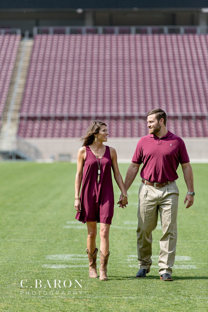12th man; Aggie Barn; Aggie ring; Aggies; Bluebonnets; C. Baron Photography; Campus; College Station Engagement Photographer; Cowboy boots; E-session; Houston wedding Photographer; Kyle Field; Texas A&M University; Whoop; Wildflowers; maroon dress; stadium;