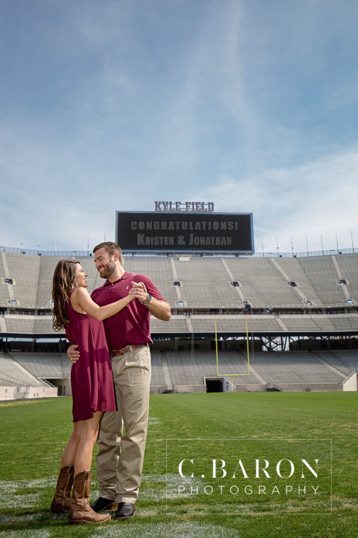 12th man; Aggie Barn; Aggie ring; Aggies; Bluebonnets; C. Baron Photography; Campus; College Station Engagement Photographer; Cowboy boots; E-session; Houston wedding Photographer; Kyle Field; Texas A&M University; Whoop; Wildflowers; maroon dress; stadium;