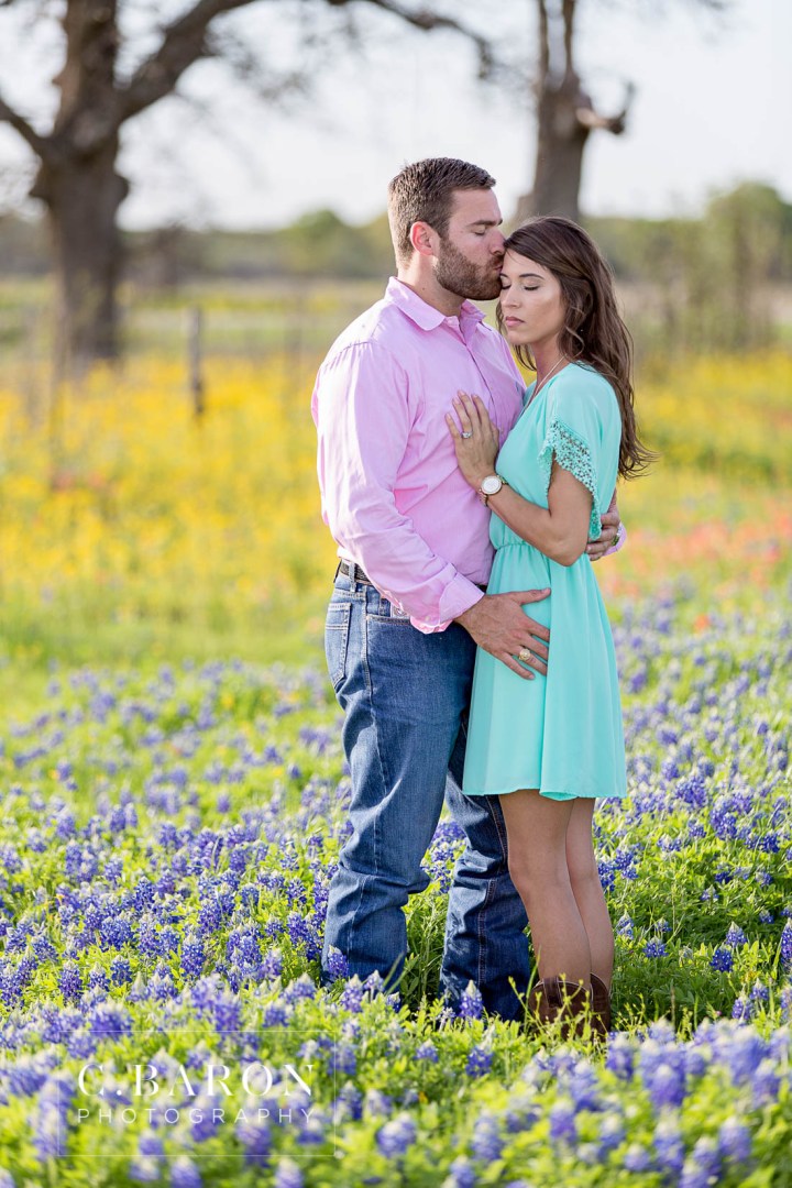 12th man; Aggie Barn; Aggie ring; Aggies; Bluebonnets; C. Baron Photography; Campus; College Station Engagement Photographer; Cowboy boots; E-session; Houston wedding Photographer; Kyle Field; Texas A&M University; Whoop; Wildflowers; maroon dress; stadium;