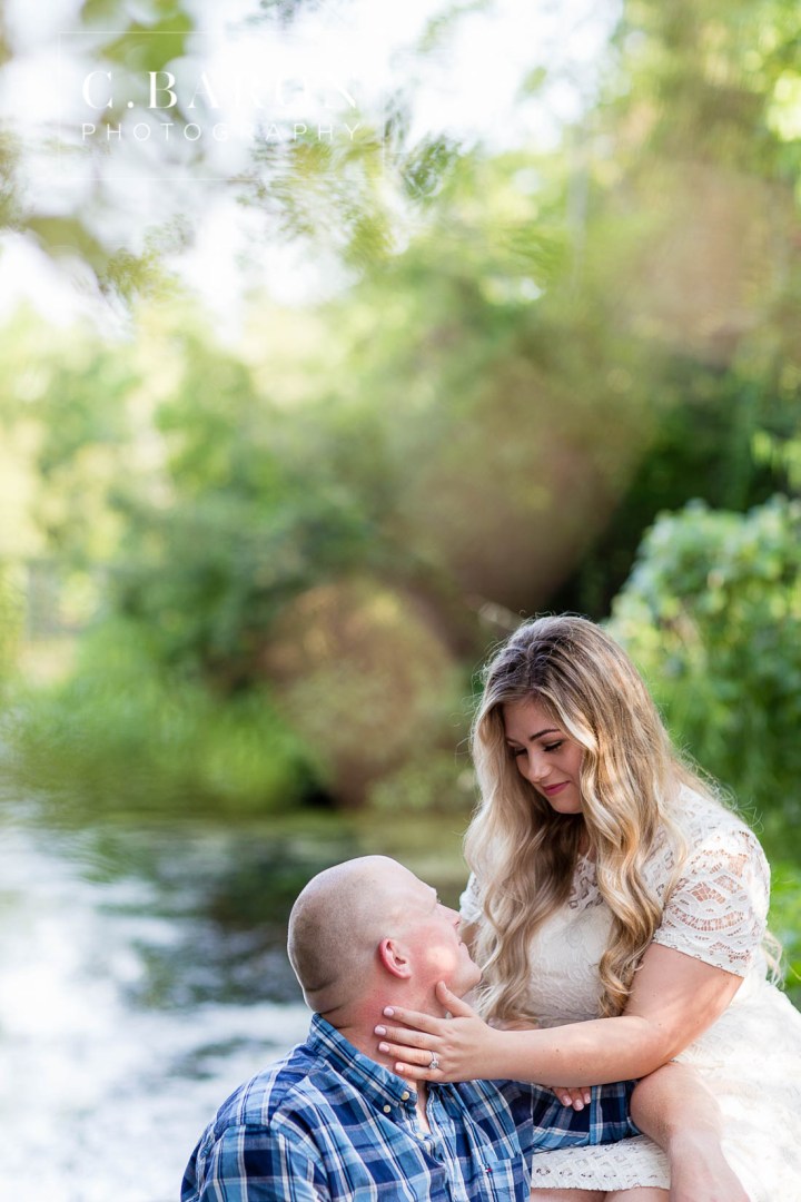 C. Baron Photography; Cowboy boots; Dog; E-session; Engagement session; Fur Baby; German Shepherd; Houston Engagement Photographer; Nature; Park; Pond; Tomball Engagement photographer; Woodlands Engagement Photographer; dock; lace dress; log cabin;