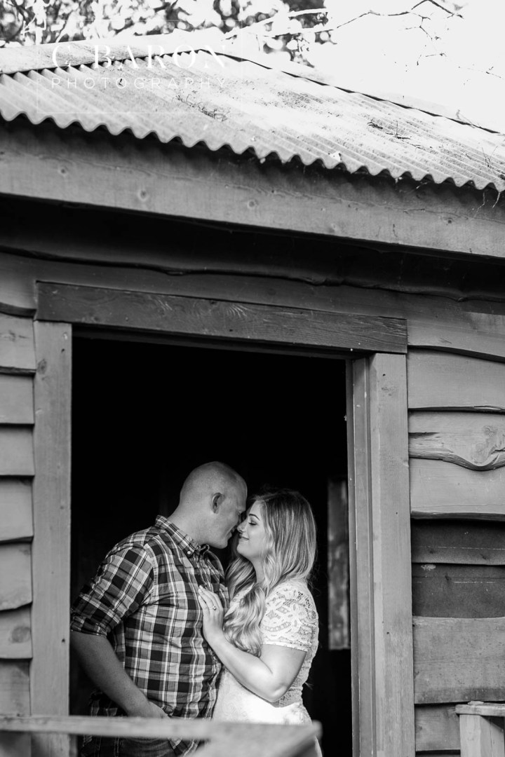 C. Baron Photography; Cowboy boots; Dog; E-session; Engagement session; Fur Baby; German Shepherd; Houston Engagement Photographer; Nature; Park; Pond; Tomball Engagement photographer; Woodlands Engagement Photographer; dock; lace dress; log cabin;