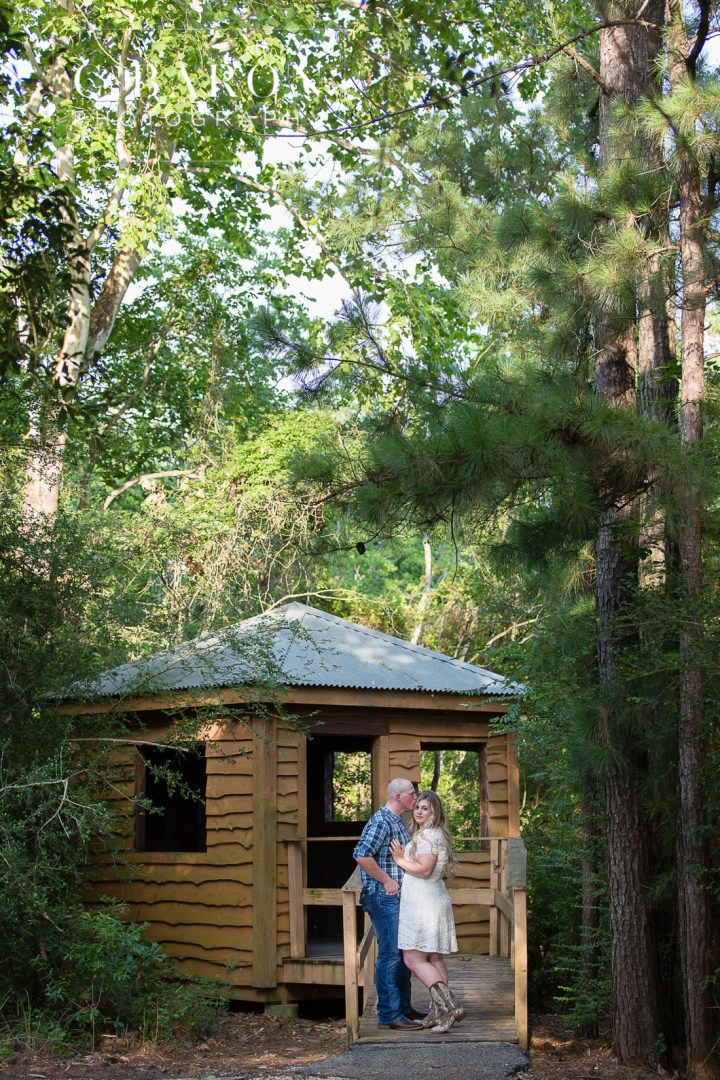 C. Baron Photography; Cowboy boots; Dog; E-session; Engagement session; Fur Baby; German Shepherd; Houston Engagement Photographer; Nature; Park; Pond; Tomball Engagement photographer; Woodlands Engagement Photographer; dock; lace dress; log cabin;