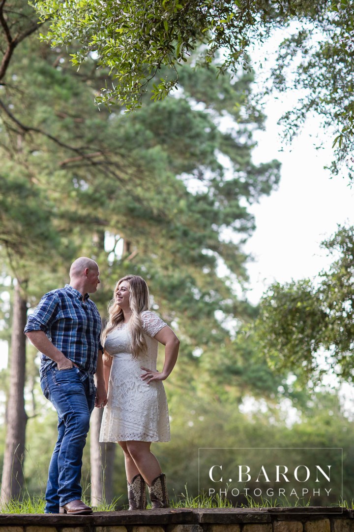 C. Baron Photography; Cowboy boots; Dog; E-session; Engagement session; Fur Baby; German Shepherd; Houston Engagement Photographer; Nature; Park; Pond; Tomball Engagement photographer; Woodlands Engagement Photographer; dock; lace dress; log cabin;