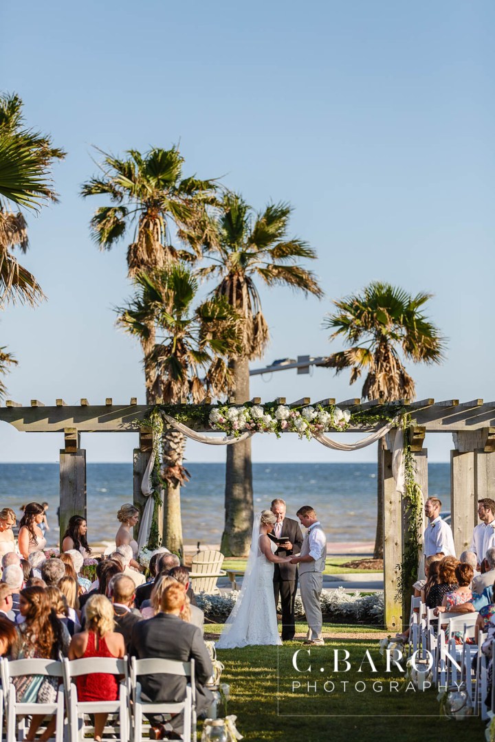 Anniversary Dance; Beach; Carriage; Centennial Lawn; Christian Louboutin; Galveston Island; Galveston Wedding Photographer; Gold; Hankies; Hansom cab; Hotel Galvez; Houston wedding Photographer; Lace gown; Music Hall; Naked cake; Outdoor Ceremony; Palm Trees; Pink; Ribbon Wands; Seawall; blush; champagne; embroidered handkerchief; flower crown; horse; hydrangea; strings;