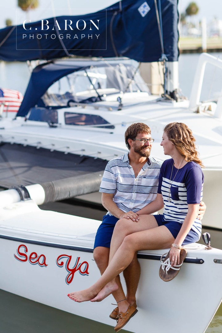 C. Baron Photography; Clear Lake Wedding Photographer; E Session; Engagement session; Houston wedding Photographer; Lakewood Yacht Club; Marina; Masts; Nautical; Nautical Engagement session at the Lakewood Yacht Club in Seabrook Texas; On the water; Sailboat; Seabrook; Texas; Trimaran; Nautical Engagement session at the Lakewood Yacht Club in Seabro; sandals; summer; sunset;