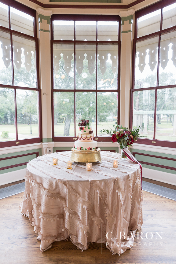 A Particular Event; Adorne Artistry; C. Baron Photography; Cakes by Jula; Carriage Caterers; Galveston Historical Foundation; Galveston Island Texas; Galveston Wedding Photographer; Galveston Weddings; Garten Verein; HH Design House; Houston Wedding PHotographer; Indoor ceremony; Kempner Park; Maroon; Maroon tux; Peach; Pearls; Red; Rolls Royce; Scarlet; Something Blue Bridal; Victorian; Vintage Limo; Wedding gown with pockets; Wine; Wine colored tux; crimson; gold; loose florals; rainy day; rose gold crystal belt; traditional; winter;