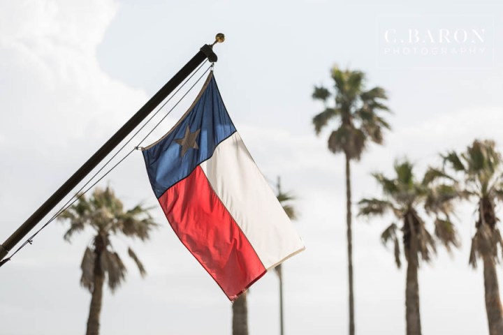 2 piece wedding dress; Ballroom reception; Beach; Black Tie; C. Baron Photography; Couple shots on the Beach; Elegant; Galveston Island; Galveston Texas; Galveston Wedding Photographer; Historic Hotel; Horse and Carriage exit; Hotel Galvez; Jetties; Oleander Garden; Rose Petal Leave; Swanky Photobooth; winter;