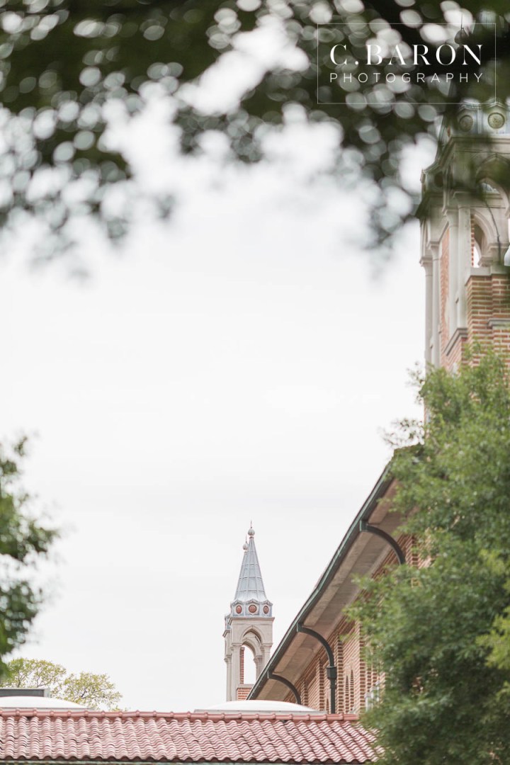 C. Baron Photography; Houston Engagement Photographer; Live Oaks; Rainy Day; Rice University; Texas Weddings; archway; blue shirt; heads together; summer;